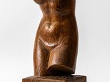 an image of a wooden sculpture of a woman on a wooden block