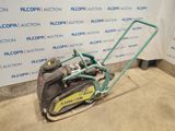 an image of a lawn mower parked in a garage