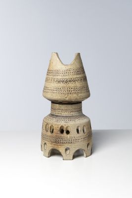 a small vase that is sitting on top of a table