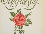 an old book with a rose on the cover of it