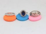 three rings are sitting on top of each other on a white surface