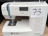 a sewing machine that is sitting on a table