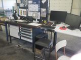 an image of a work area with a desk and two monitors