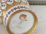 a vase that has a picture of a woman on it