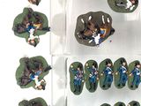 a lot of figurines that are in a display case
