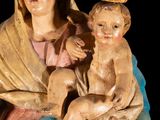 an image of a statue of a woman holding a baby and a cross
