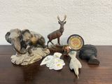 a table with a lot of animal figurines on it