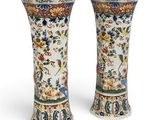 pair of chinese vases decorated with flowers and birds on a white background