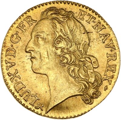 gros plan d'une pièce d'or portant un visage de femme