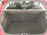 a trunk of a red car with the back seats down