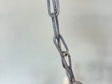 a lamp that has a chain attached to it