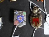 a lot of badges on a black surface
