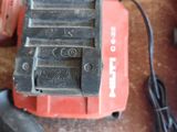 a cordless drill and a cordless hammer on a table