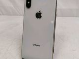 an apple iphone is sitting on a stand on a white surface