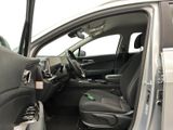 the interior of a car with the door open and the driver ' s seat down