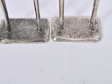 pair of antique silver plated candlesticks on stand