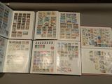 many different types of stamps on the pages of a book