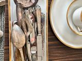 a tray with silverware and a cup of coffee on a table