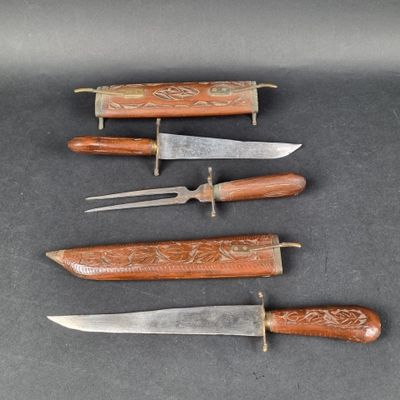 five different types of knifes are lined up on a table