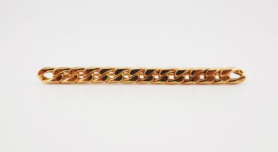 a gold chain bracelet on a white background