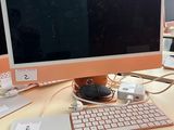 a computer on a desk with a keyboard and mouse