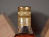 a bottle of whiskey that is sitting on a table