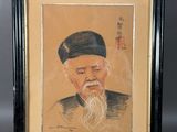 un vieux tableau représentant un homme à la longue barbe et coiffé d'un chapeau