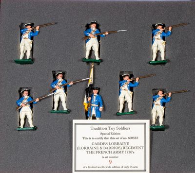 a display of toy soldiers in blue uniforms
