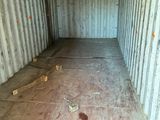 an image of a empty storage container in the middle of a room