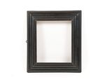 a picture of a black picture frame on a white wall