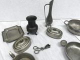 a lot of silver items that are on a table