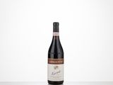 a bottle of red wine sitting on top of a table
