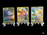 three pokemon cards are lined up in a row on a black background