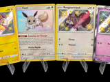 several pokemon cards are lined up in a row on a black background