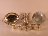 a lot of silver items that are on the table