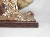 a statue of a cat that is sitting on a table