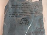a blue plastic bag with a recycleable sign on it