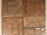 four pieces of wood on the wall of a room