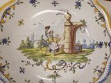 a plate with a picture of a man and a woman on it
