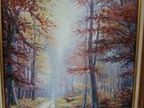 tableau représentant une route dans une forêt, avec des arbres et des feuilles