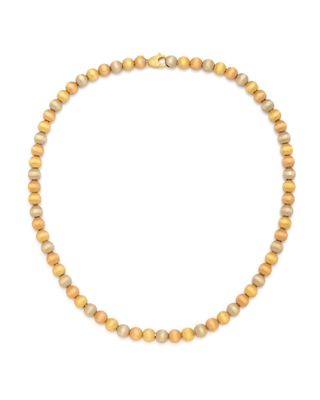 a yellow beaded necklace on a white background