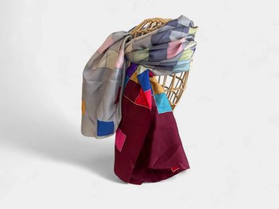 an image of a chair with a blanket on top of it