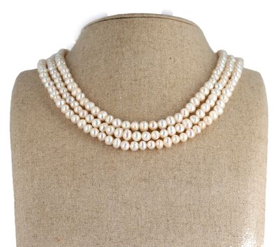 a close up of a necklace on a mannequin mannequin