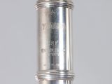 a close up of a silver object on a table