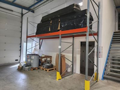 an image of a garage with a staircase and a storage area