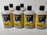 four bottles of tarps and coussins are lined up on a table