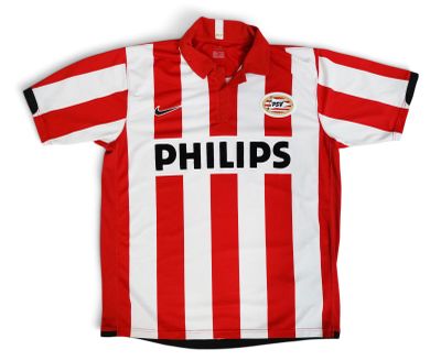 a close up of a red and white striped shirt with the word phillips on it