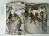 an open book with a picture of a man on it