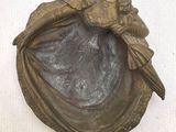 a statue of a woman holding a baby in her arms