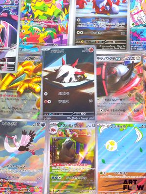 a lot of pokemon cards that are on the table